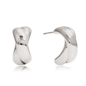 Detail of twisted silver C-shaped earrings with metallic spiral texture on white background