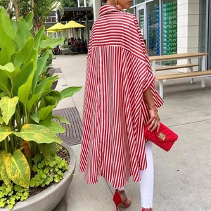 Outdoor street style shot of the back design and silhouette of a red striped shirt