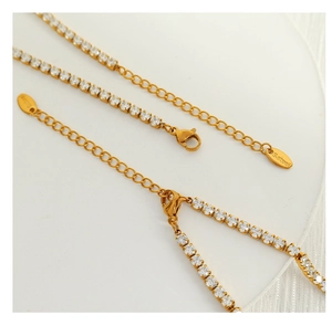 Detail of gold-plated stainless steel tennis chain with zircons and adjustable clasp