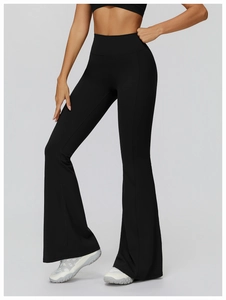 Detail showing the fit and high waist of black flared yoga pants with slim cut design