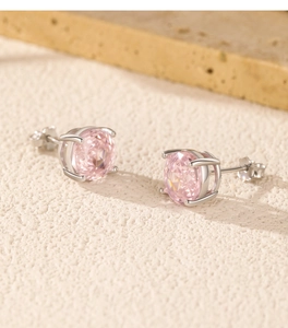 Detailed shot of S925 sterling silver stud earrings with round pink rose-cut stones