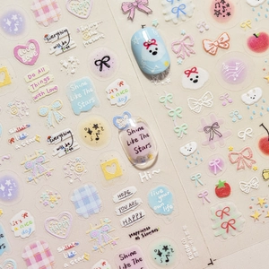 Close-up of cute puppy and bow nail stickers with Shine Like The Stars text detail
