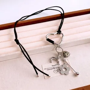 Vintage cotton cord necklace featuring heart carabiner with dog and dalmatian stone charms