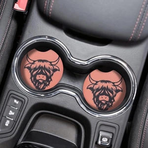 Set of two pink highland cow car coasters with black farm animal pattern in cup holder