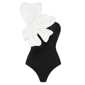 Detail of 3D white butterfly applique with pearl beads on black one-shoulder swimsuit