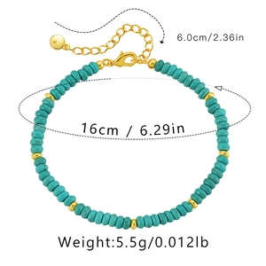 Detail of bohemian turquoise beaded bracelet with gold-plated extender chain and lobster clasp