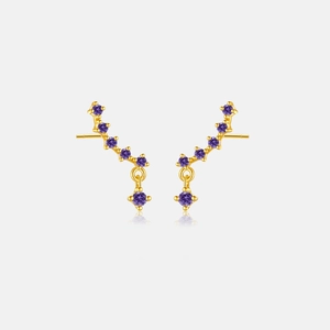 Detail of s925 silver ear crawlers with seven purple zircons in gold setting