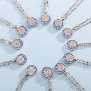 Set of 12 zodiac gold plated necklaces with blue enamel coin pendants for women