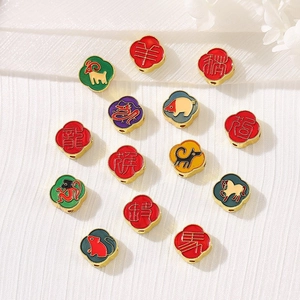 Detailed top view of colorful enamel Chinese zodiac beads with gold-plated metal borders