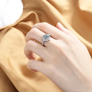 Close-up of a sparkling halo diamond ring with small zircon stones on the band