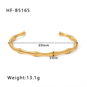 Macro detail of gold bamboo cuff bracelet showing 5mm width and 69mm diameter