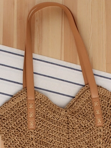 Handmade woven paper rope beach bag with brown leather handles for summer travel