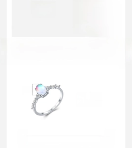 Close-up of S925 sterling silver ring featuring an oval opal and S925 hallmark
