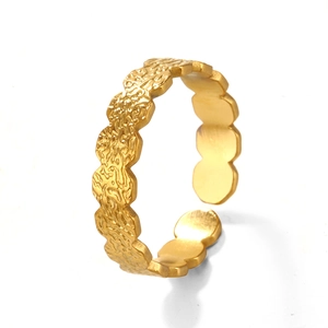 French vintage hammered gold stainless steel open ring with wavy texture on white background