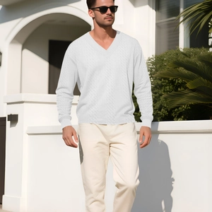 Men's casual white V-neck cable knit sweater with long sleeves in a bright outdoor setting