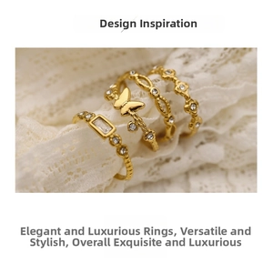 Macro shot of gold butterfly and rhinestone ring set on a delicate white lace background