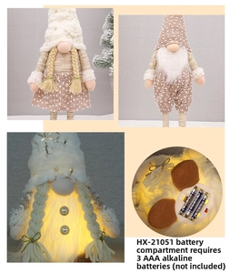 Detail view of glowing Christmas gnomes with LED lights and battery compartment base