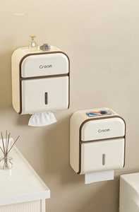 Detail of cream wave wall-mounted toilet tissue box with top shelf for bathroom items