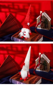 Close-up of red and beige Christmas gnomes with knit hats and long white faux fur beards
