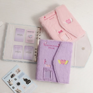 Internal view of A5 plush photocard binder with 3-ring metal binder and clear card slots