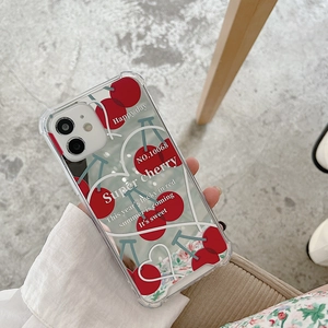 Close-up of clear cherry phone case with heart patterns and Super Cherry text