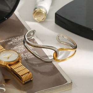 Minimalist 18K gold and silver two-tone knotted stainless steel open cuff bracelet