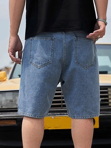 Men's loose fit washed blue denim shorts with rear pockets and retro street style