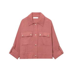 Women's minimalist rust pink linen-style shirt jacket with chest pockets and metal buttons