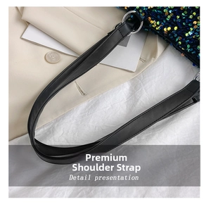 Detail of premium black leather shoulder strap with silver metal ring and colorful sequins