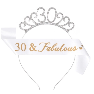 Close-up of silver rhinestone 30th birthday crown and white 30 & Fabulous satin sash
