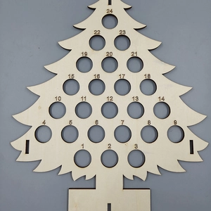Detailed view of the 24-hole wooden Christmas tree countdown calendar for wine bottles