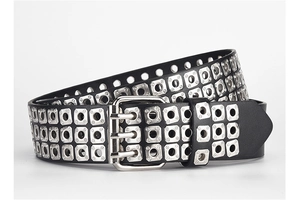 Detail of a punk PU leather belt featuring three rows of silver eyelets and a square buckle