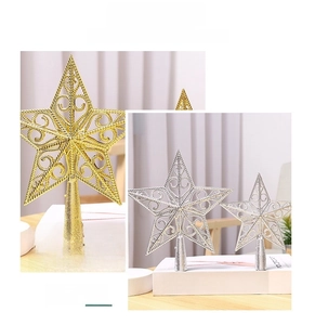 Detailed view of hollow wire star tree topper in gold and silver metallic finishes