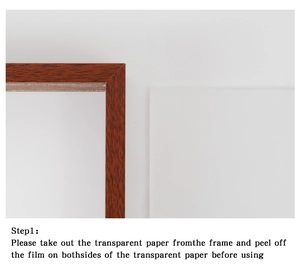 Detail view of the vintage wooden frame showing the protective film on acrylic panel
