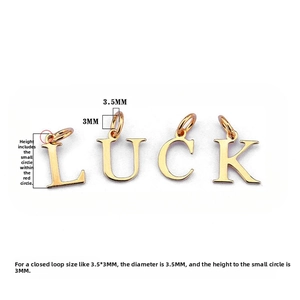 Detail view of 925 silver gold-plated LUCK letter charms with 3.5mm height measurement
