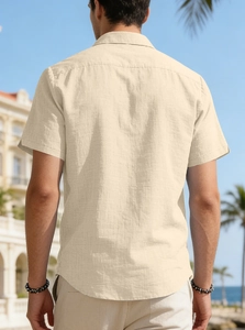 Rear view of men's cream short sleeve polo shirt showing premium linen cotton texture