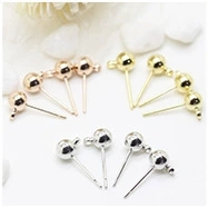 Close-up of DIY ball stud earrings with hanging loops in gold, silver, and rose gold