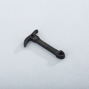 Close-up of a T-shaped black stainless steel pickaxe pendant accessory with dual holes