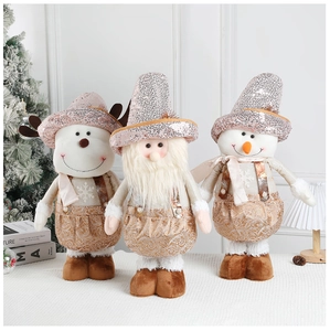 Three plush Christmas dolls featuring Santa, reindeer and snowman with rose gold sequins