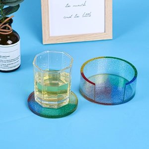 Rainbow glitter resin coaster set with C-shaped storage holder in a lifestyle setting
