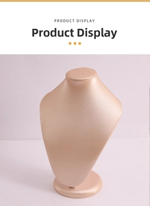 Detail of bust-shaped jewelry display stand with champagne gold satin finish and round base