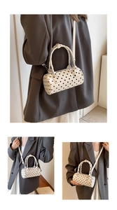 Polka dot Boston bag with detachable long strap and metal zipper close-up view