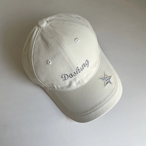 Detail of cream cotton baseball cap with Dashing embroidery and plaid star patch