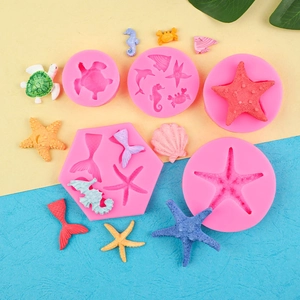 Pink silicone marine life chocolate molds featuring seahorse, starfish, and sea shells