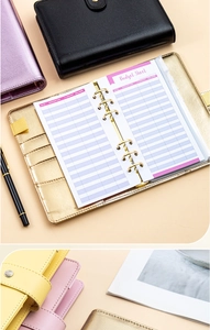 Flat lay of colorful PU leather 6-ring budget binders with English budget tracking sheets