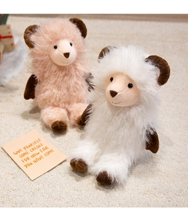 Close-up of white and pink plush goat dolls with fluffy texture on a beige rug
