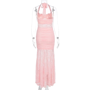Detail view of the lace-up open back and intricate floral lace on this pink fishtail dress