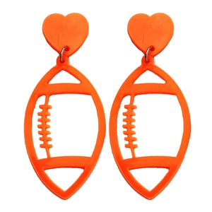 Vibrant orange acrylic heart and hollow rugby football drop earrings on white background