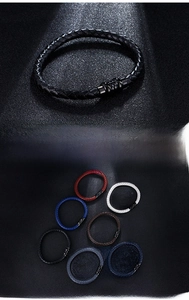 Detail of multi-colored braided leather bracelets with stainless steel magnetic clasps