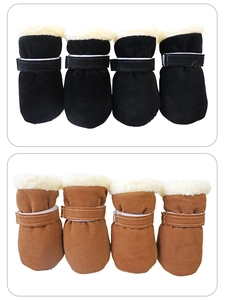 Close-up of suede pet snow boots with warm fleece lining and adjustable magic tape straps